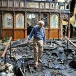 Tom Evangelou, the treasurer of St. John the Baptist Albanian Orthodox Church in South Boston spent the day trying to recover church items that were damaged in a five-alarm fire on Tuesday.